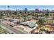 Expansive aerial view of a landscaped home featuring a pool, circular driveway and desert landscaping at 2711 Ashby Ave, Las Vegas, NV 89102