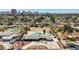 Expansive aerial view of a landscaped home featuring a pool, circular driveway and desert landscaping at 2711 Ashby Ave, Las Vegas, NV 89102