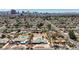 Wide aerial view featuring a desert home with pool and putting green, surrounded by mature trees at 2711 Ashby Ave, Las Vegas, NV 89102