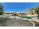 Expansive backyard showcasing a pool, outdoor dining, and pristine landscaping, creating an entertainer's dream space at 2711 Ashby Ave, Las Vegas, NV 89102