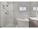 Modern bathroom with walk-in shower, soaker tub, and stylish tile work at 2711 Ashby Ave, Las Vegas, NV 89102