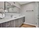 Bathroom with double vanity, marble countertop, sleek fixtures, and glass-enclosed shower at 2711 Ashby Ave, Las Vegas, NV 89102