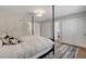 Bedroom showcasing a four-poster bed, modern rug, closet doors, and neutral decor at 2711 Ashby Ave, Las Vegas, NV 89102