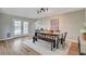 Bright dining room featuring hardwood floors, stylish lighting, and a modern table with bench seating at 2711 Ashby Ave, Las Vegas, NV 89102