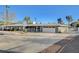 Exterior showing brick accents, a well-manicured lawn, and an expansive driveway at 2711 Ashby Ave, Las Vegas, NV 89102