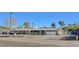 Sprawling single-story home boasting a gray brick exterior, attached two-car garage, and mature landscaping at 2711 Ashby Ave, Las Vegas, NV 89102