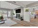 Spacious living room featuring a fireplace, large television, and access to the kitchen at 2711 Ashby Ave, Las Vegas, NV 89102