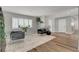 Sitting room featuring shutters, hardwood floors, and decorative plants creating a cozy space at 2711 Ashby Ave, Las Vegas, NV 89102