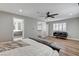 Large main bedroom features an ensuite bathroom, walk-in closet, hardwood floors, and a ceiling fan at 2711 Ashby Ave, Las Vegas, NV 89102