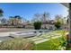 Beautiful backyard showcasing a pool and spa, accented by lush landscaping and contemporary outdoor furniture at 2711 Ashby Ave, Las Vegas, NV 89102