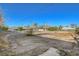 Expansive vacant lot with mature trees offers a blank canvas for building your dream home at 2711 Ashby Ave, Las Vegas, NV 89102