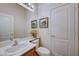 Powder room with single sink, framed mirror, and white fixtures at 2714 Thomasville Ave, Henderson, NV 89052