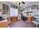 This bedroom features built in cabinets and shelving, as well as a ceiling fan and neutral paint at 2714 Thomasville Ave, Henderson, NV 89052