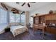 Charming bedroom with a ceiling fan and adjacent desk and bookshelf set at 2714 Thomasville Ave, Henderson, NV 89052