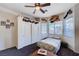 Cozy bedroom with ceiling fan, closet, and large window for natural lighting at 2714 Thomasville Ave, Henderson, NV 89052