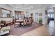 Elegant dining room featuring a large wooden table, ornate hutch, and tray ceiling at 2714 Thomasville Ave, Henderson, NV 89052