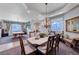 Elegant dining room with natural light, stylish furniture, and an open layout at 2714 Thomasville Ave, Henderson, NV 89052