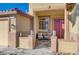 Inviting front porch with seating, decorative columns, and a red entry door at 2714 Thomasville Ave, Henderson, NV 89052