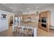 Well-lit kitchen with granite countertops, stainless steel appliances, and a center island with seating at 2714 Thomasville Ave, Henderson, NV 89052