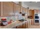 Kitchen featuring stainless steel appliances, granite countertops, and tile backsplash at 2714 Thomasville Ave, Henderson, NV 89052