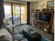 Relax in the living room with balcony access and views of the lake at 29 Montelago # 108, Henderson, NV 89155