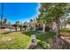 Poolside backyard oasis featuring a pool, trees, and outdoor dining area at 2974 Lindell Rd, Las Vegas, NV 89146