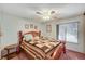 Comfortable bedroom with a decorative quilt, ceiling fan, and window for natural light at 2974 Lindell Rd, Las Vegas, NV 89146