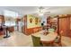 Open dining room with a view of the kitchen and living room, featuring wood cabinetry at 2974 Lindell Rd, Las Vegas, NV 89146