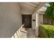 Inviting front entrance featuring a secure metal gate, a cozy porch, and manicured greenery, offering both security and curb appeal at 2974 Lindell Rd, Las Vegas, NV 89146