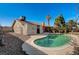 An inviting in-ground pool with safety handrails is surrounded by a spacious patio and mature landscaping at 2974 Lindell Rd, Las Vegas, NV 89146