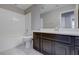 Bathroom with dark cabinets, toilet, and shower/tub combination at 3026 Coveri Ct, Las Vegas, NV 89141