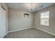 Neutral bedroom with carpet, chandelier, window, and closet at 3026 Coveri Ct, Las Vegas, NV 89141