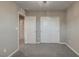 Bedroom with carpet, a sliding closet and chandelier at 3026 Coveri Ct, Las Vegas, NV 89141