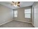 Bedroom with ceiling fan, closet, and two bright windows at 3026 Coveri Ct, Las Vegas, NV 89141