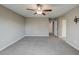 Large bedroom with carpet, neutral walls, ceiling fan, and bright natural light at 3026 Coveri Ct, Las Vegas, NV 89141