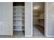 Walk-in closet with shelving on one side and rods with shelves in the back at 3026 Coveri Ct, Las Vegas, NV 89141