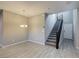 Open-concept dining area featuring stairs and a modern chandelier at 3026 Coveri Ct, Las Vegas, NV 89141