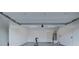 Clean, well-lit garage space with exercise bike and water heater at 3026 Coveri Ct, Las Vegas, NV 89141