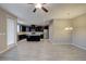 Open-concept kitchen and dining area features dark cabinets and stainless steel appliances at 3026 Coveri Ct, Las Vegas, NV 89141