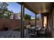 Cozy backyard patio with outdoor seating, a well manicured lawn, and desert landscape at 3034 Scenic Rhyme Ave, Henderson, NV 89044