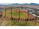 A well-maintained baseball field with manicured grass and netting provides a recreational space for residents at 3034 Scenic Rhyme Ave, Henderson, NV 89044