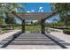 A shady park with benches and walking path is enhanced by a pavilion and beautiful desert landscaping at 3034 Scenic Rhyme Ave, Henderson, NV 89044