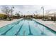 The community pool area features lap lanes, ample lounge chairs, and plenty of shaded areas to relax at 3034 Scenic Rhyme Ave, Henderson, NV 89044