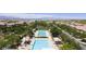 Community pool and recreation area with multiple pools, umbrellas, and lounge chairs for residents at 3034 Scenic Rhyme Ave, Henderson, NV 89044