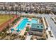 Community pool and recreation area with multiple pools, umbrellas, and lounge chairs for residents at 3034 Scenic Rhyme Ave, Henderson, NV 89044