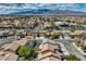 An elevated view capturing a neighborhood with tile roofs and desert landscaping at 3516 Bryan Keith Ave, North Las Vegas, NV 89031