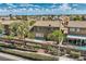 Aerial view of a backyard with lush greenery, a sparkling pool, and privacy fence at 3516 Bryan Keith Ave, North Las Vegas, NV 89031