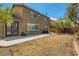 View of the home's backyard, showcasing a patio and spacious yard area at 3516 Bryan Keith Ave, North Las Vegas, NV 89031