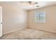 Bedroom with carpet, neutral colored walls, and a window with shutters at 3516 Bryan Keith Ave, North Las Vegas, NV 89031