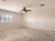 Spacious bedroom with neutral colored walls, carpet, and a window with shutters at 3516 Bryan Keith Ave, North Las Vegas, NV 89031